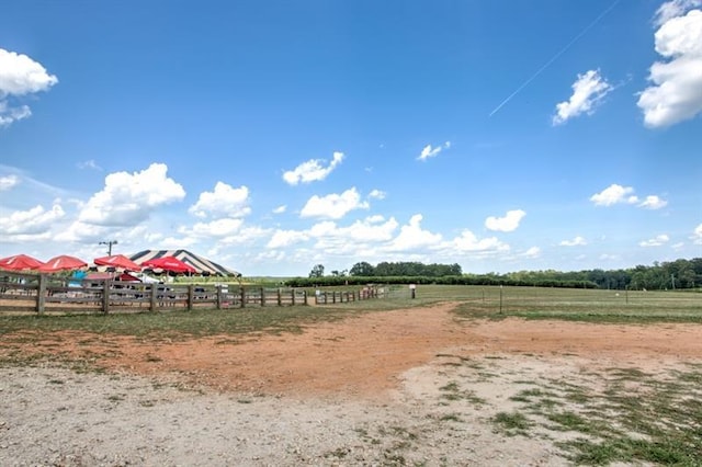 view of yard with a rural view