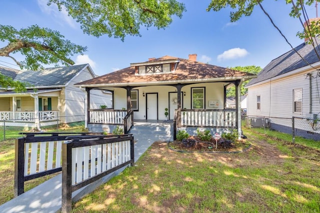 11 Poplar St, Porterdale, GA 30014 - view of front facade featuring a porch, a chimney, and central air condition unit