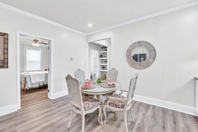 11 Poplar St, Porterdale, GA 30014 - dining space with baseboards, light wood finished floors, crown molding, recessed lighting, and a ceiling fan