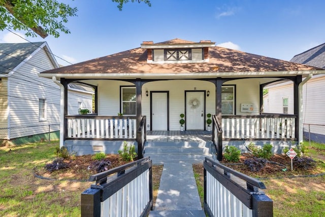 11 Poplar St, Porterdale, GA 30014 - view of front facade featuring covered porch and roof with shingles