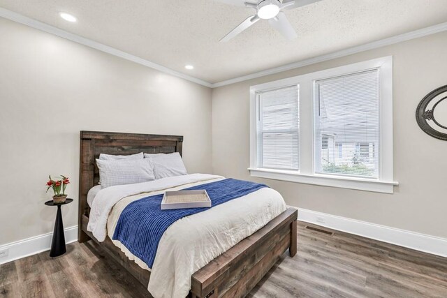 11 Poplar St, Porterdale, GA 30014 - bedroom with wood finished floors, baseboards, crown molding, recessed lighting, and ceiling fan