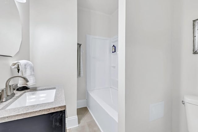 11 Poplar St, Porterdale, GA 30014 - bathroom with toilet, tile patterned floors, vanity, and baseboards
