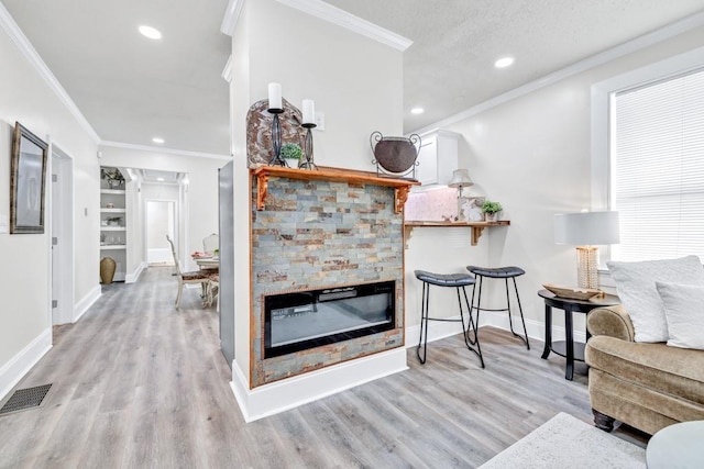 11 Poplar St, Porterdale, GA 30014 - living area featuring light wood finished floors, crown molding, a fireplace, baseboards, and recessed lighting