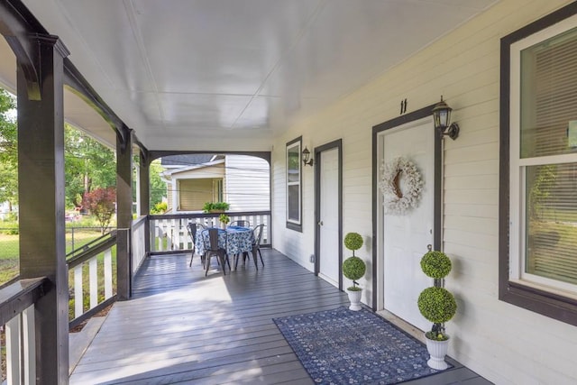 11 Poplar St, Porterdale, GA 30014 - wooden terrace featuring covered porch