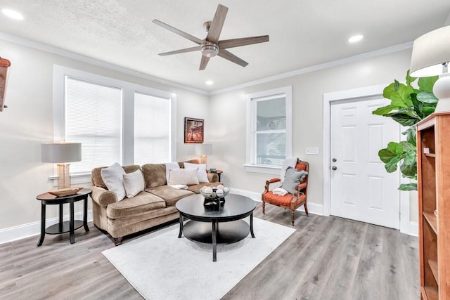 11 Poplar St, Porterdale, GA 30014 - living area with light wood-type flooring, ornamental molding, a ceiling fan, recessed lighting, and baseboards