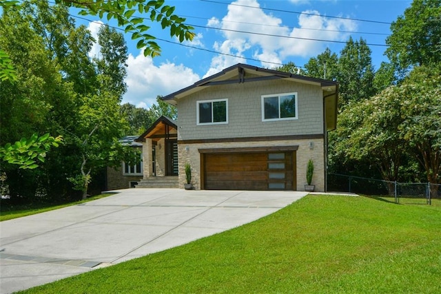 view of front facade with a garage and a front lawn