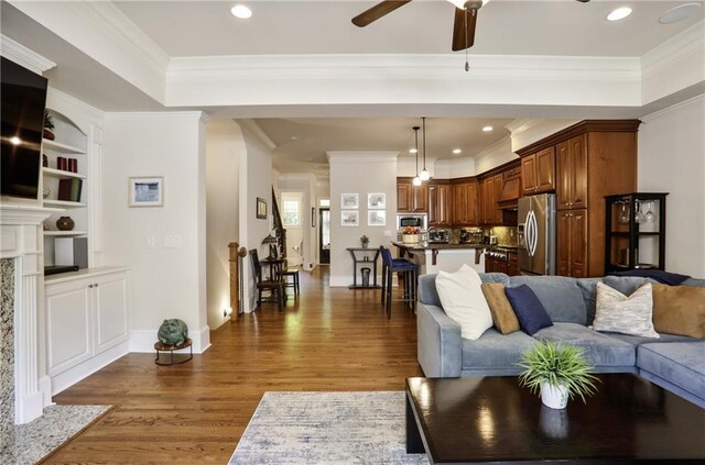 225 Mystic Ridge Hl, Sandy Springs, GA 30342 - living area featuring wood finished floors, a ceiling fan, crown molding, recessed lighting, and a raised ceiling