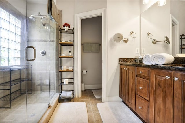 225 Mystic Ridge Hl, Sandy Springs, GA 30342 - bathroom featuring vanity, a stall shower, tile patterned flooring, and baseboards