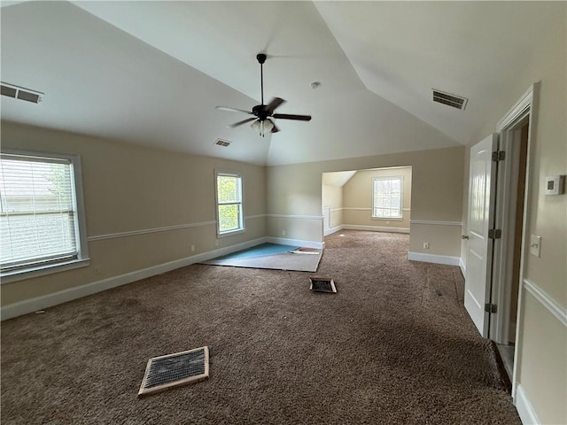 381 Plymstock Dr, Mcdonough, GA 30253 - carpeted empty room featuring vaulted ceiling, a ceiling fan, and baseboards