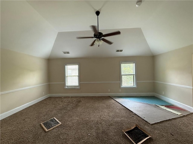 381 Plymstock Dr, Mcdonough, GA 30253 - empty room with vaulted ceiling, healthy amount of natural light, carpet floors, a ceiling fan, and baseboards