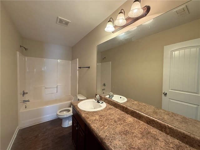 381 Plymstock Dr, Mcdonough, GA 30253 - bathroom featuring vanity, toilet, wood finished floors, and shower / bathtub combination
