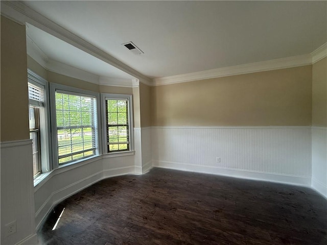 381 Plymstock Dr, Mcdonough, GA 30253 - unfurnished room featuring wood finished floors, a wainscoted wall, and ornamental molding
