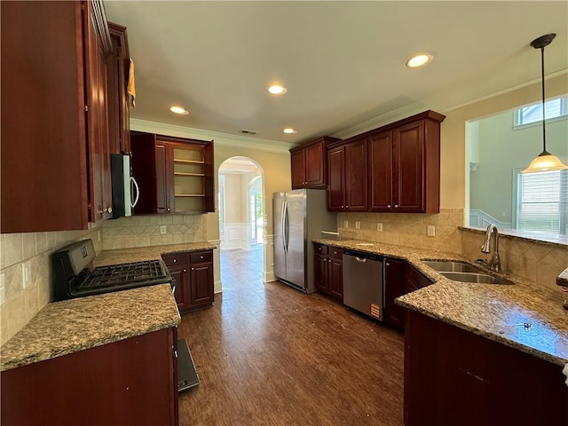 381 Plymstock Dr, Mcdonough, GA 30253 - kitchen featuring stainless steel appliances, a sink, arched walkways, open shelves, and plenty of natural light