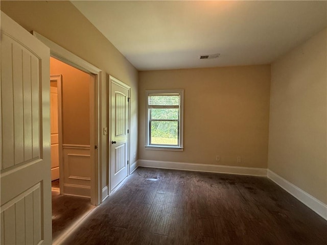 381 Plymstock Dr, Mcdonough, GA 30253 - unfurnished bedroom featuring dark wood-style floors and baseboards