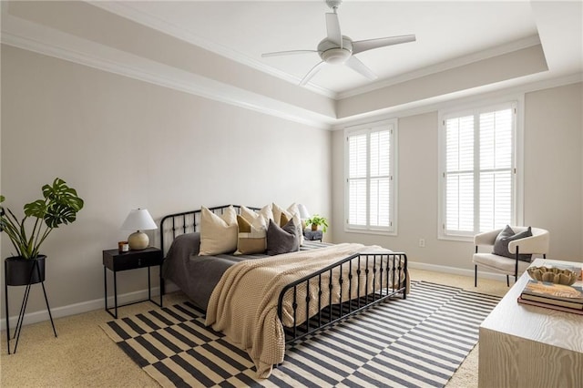 carpeted bedroom featuring crown molding and ceiling fan