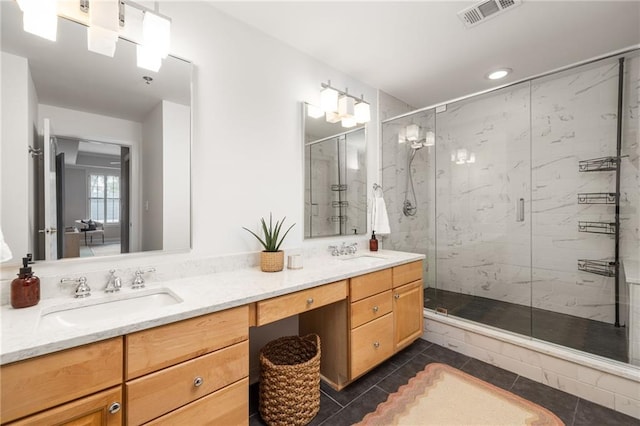 bathroom featuring vanity, tile patterned floors, and a shower with door