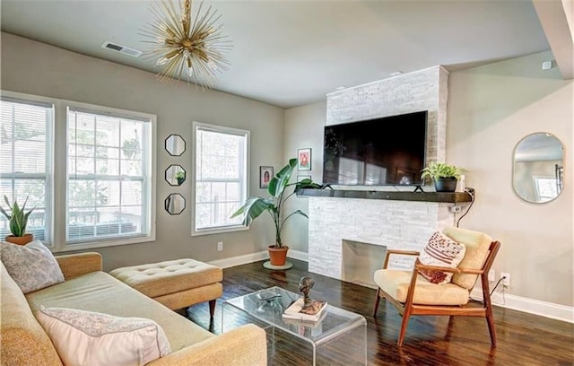 living room featuring dark hardwood / wood-style floors and a fireplace