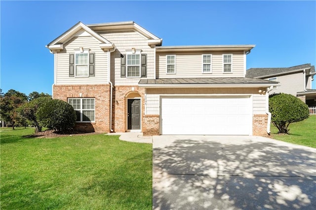 view of front of house with a garage and a front yard