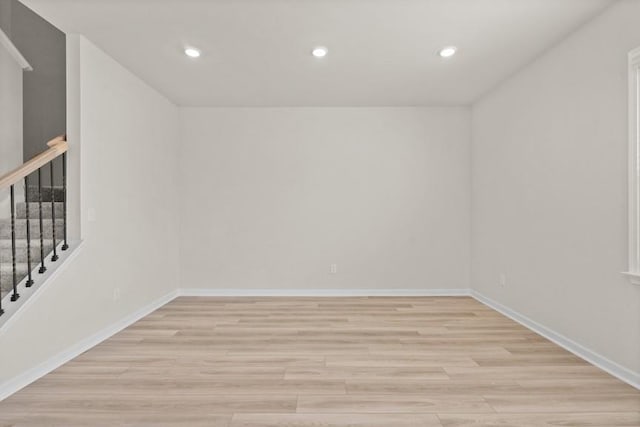 additional living space featuring light wood-type flooring