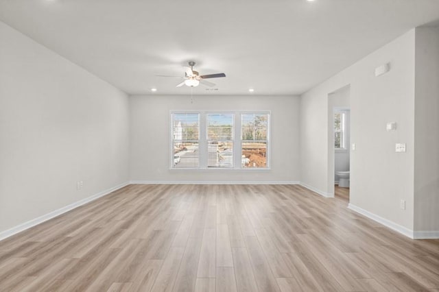 unfurnished room with light wood-type flooring and ceiling fan