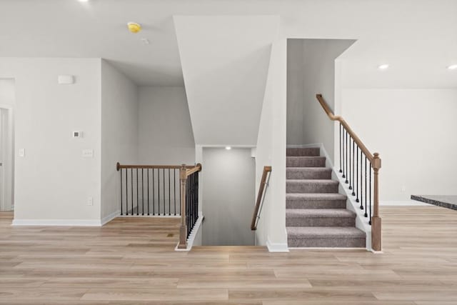 staircase featuring hardwood / wood-style flooring