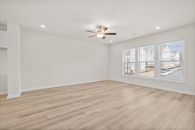 empty room featuring light wood-type flooring and ceiling fan