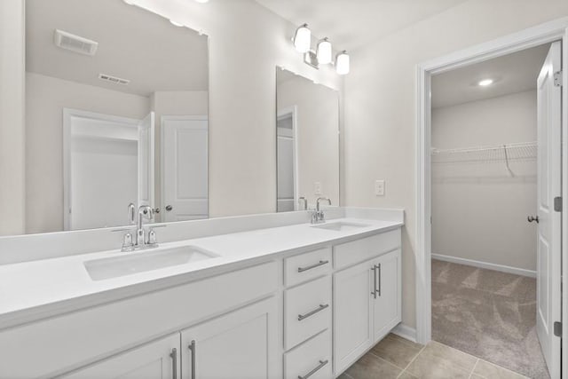 bathroom featuring tile patterned floors and vanity