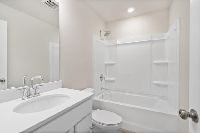 full bathroom featuring toilet, vanity, and shower / washtub combination