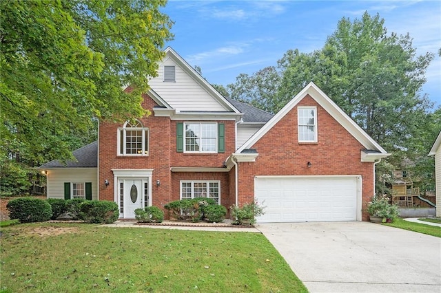 view of front of home with a garage and a front lawn