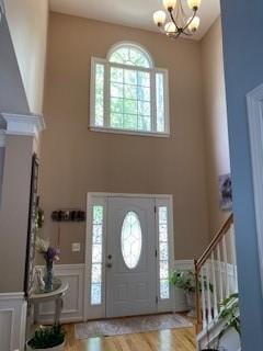 foyer featuring an inviting chandelier and light hardwood / wood-style flooring