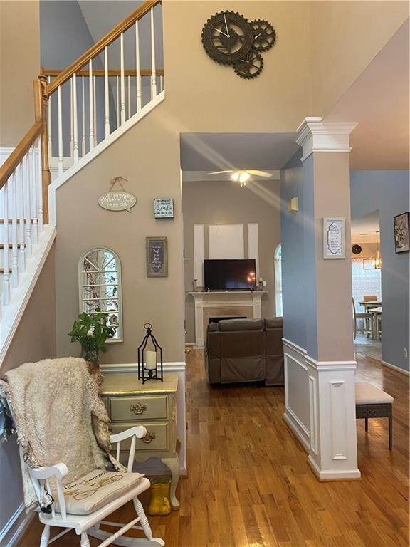 corridor featuring high vaulted ceiling and hardwood / wood-style flooring