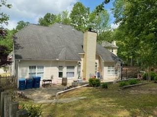 rear view of property with a patio area