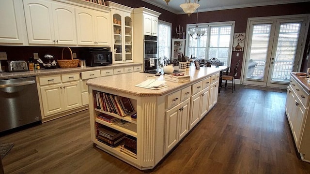 kitchen featuring a kitchen island, hanging light fixtures, ornamental molding, stainless steel appliances, and dark wood-type flooring