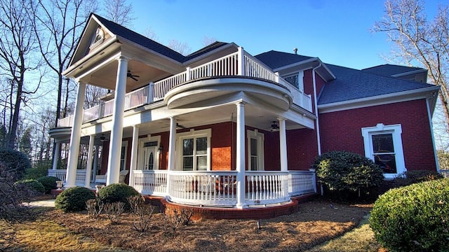 view of home's exterior featuring a balcony, a porch, and ceiling fan