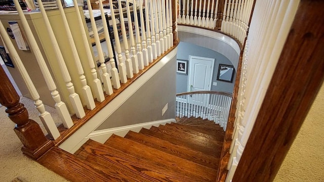 stairway featuring hardwood / wood-style floors