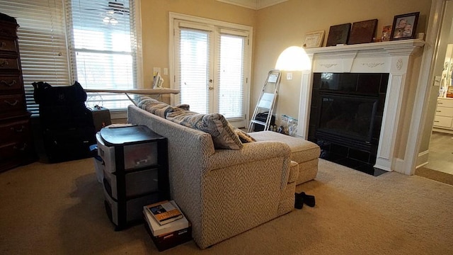 living room with ornamental molding, carpet flooring, and a healthy amount of sunlight