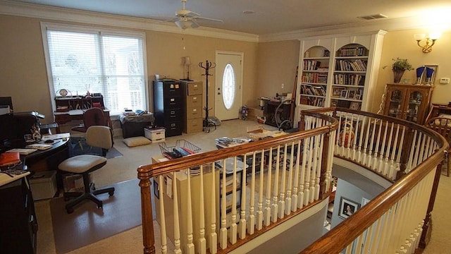 interior space with crown molding and ceiling fan