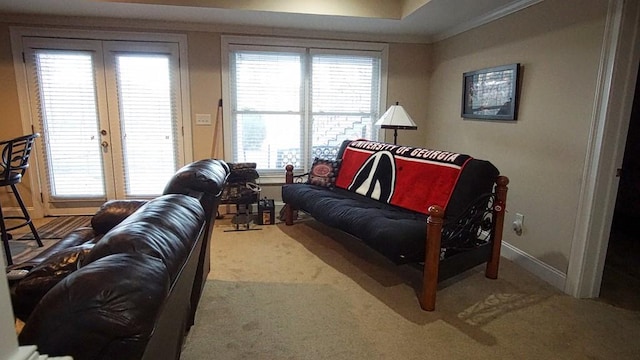 living room featuring french doors and light carpet