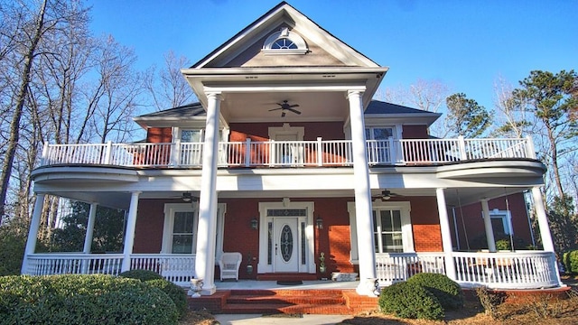 view of front of home with a porch, a balcony, and ceiling fan