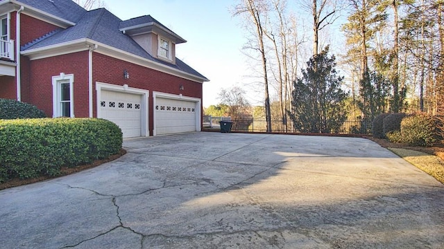 view of side of property with a garage