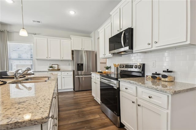 2527 Swan Lake Dr, Grayson, GA 30017 - kitchen with a sink, backsplash, stainless steel appliances, and white cabinetry