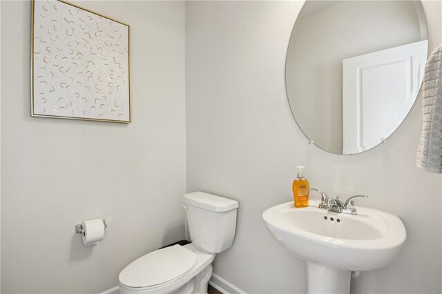 bathroom with sink and toilet