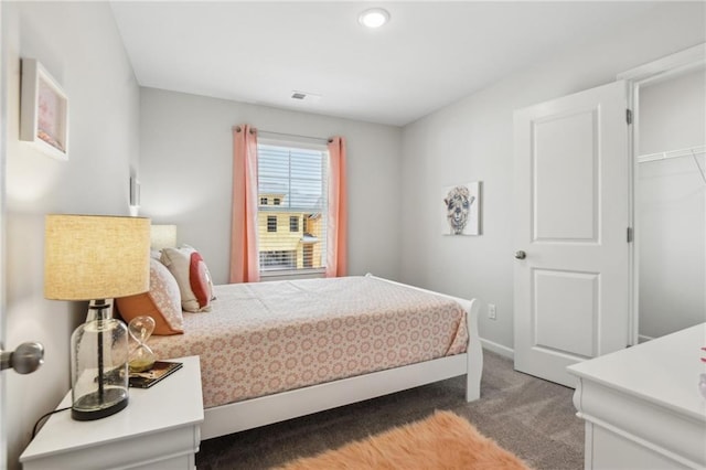 carpeted bedroom featuring a spacious closet