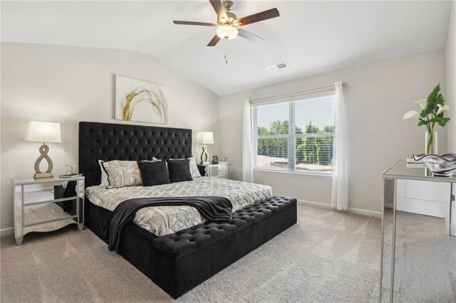 bedroom featuring vaulted ceiling, carpet, and ceiling fan