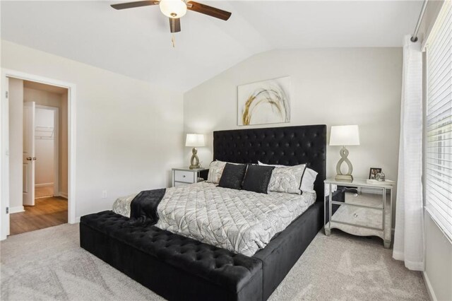 bedroom featuring ceiling fan, lofted ceiling, and carpet flooring