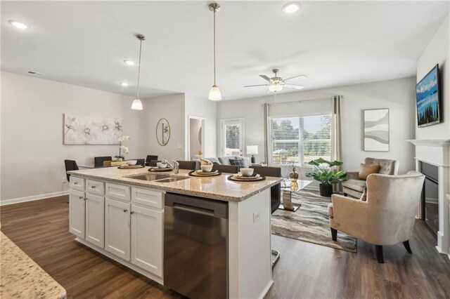 kitchen featuring white cabinets, hanging light fixtures, sink, dishwasher, and dark hardwood / wood-style flooring