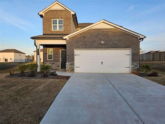 craftsman-style home with stone siding, concrete driveway, fence, and an attached garage