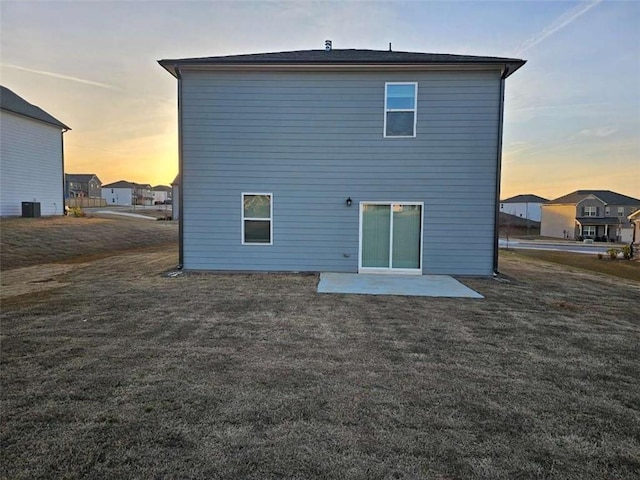 back of property featuring a residential view and a patio