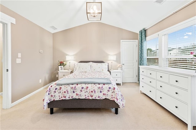 bedroom with light carpet, vaulted ceiling, visible vents, and baseboards