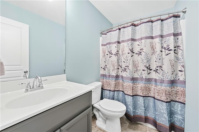 bathroom with toilet, curtained shower, and vanity